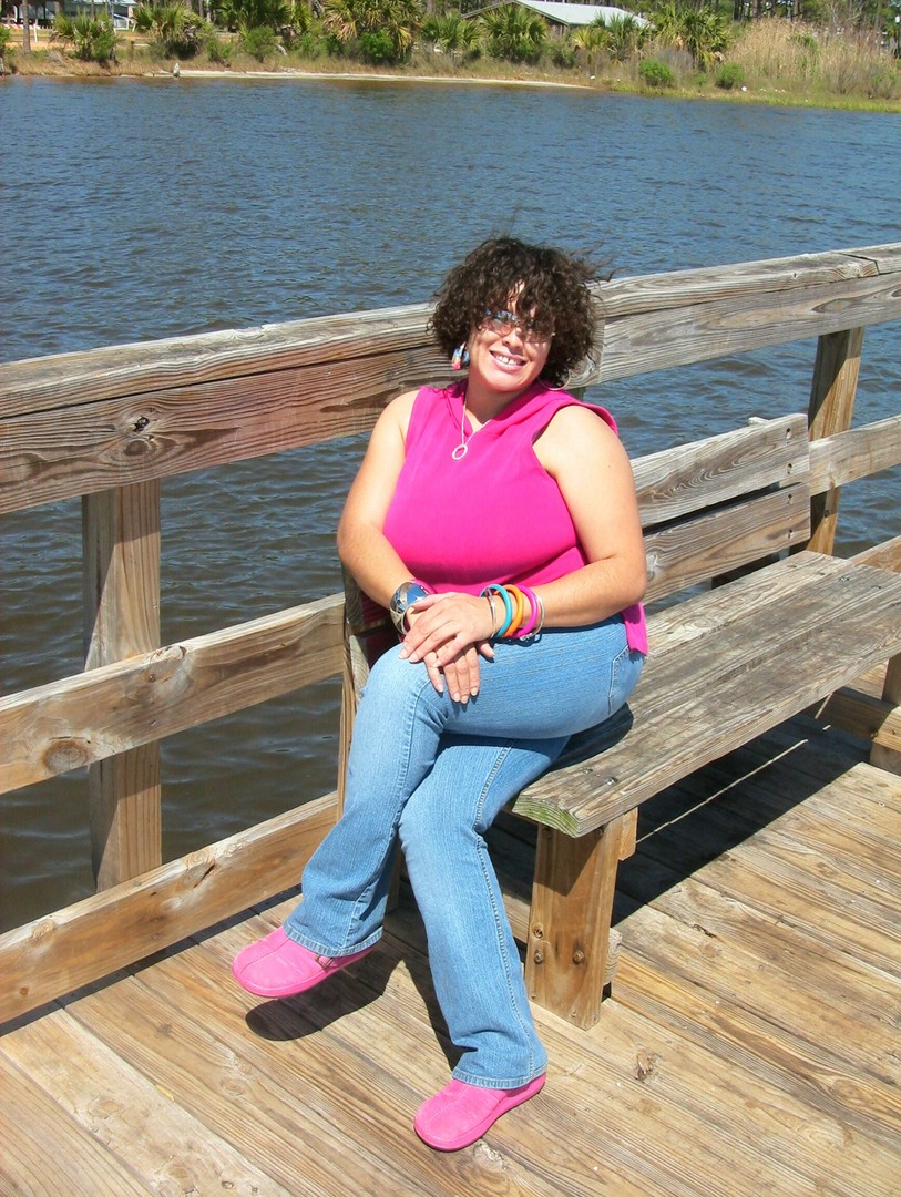 AhMei catching the breeze on the dock